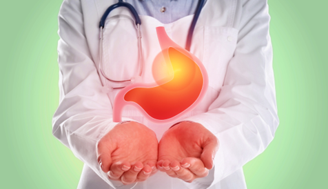 Medical professional examining a stomach, highlighting autoimmune gastritis and vitamin B12 deficiency.